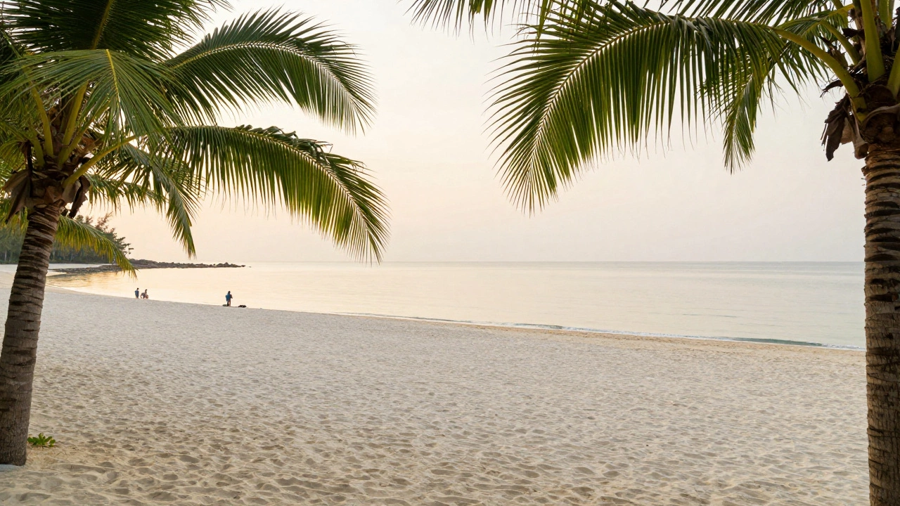 Quiet, spacious beach with soft golden light representing September shoulder season
