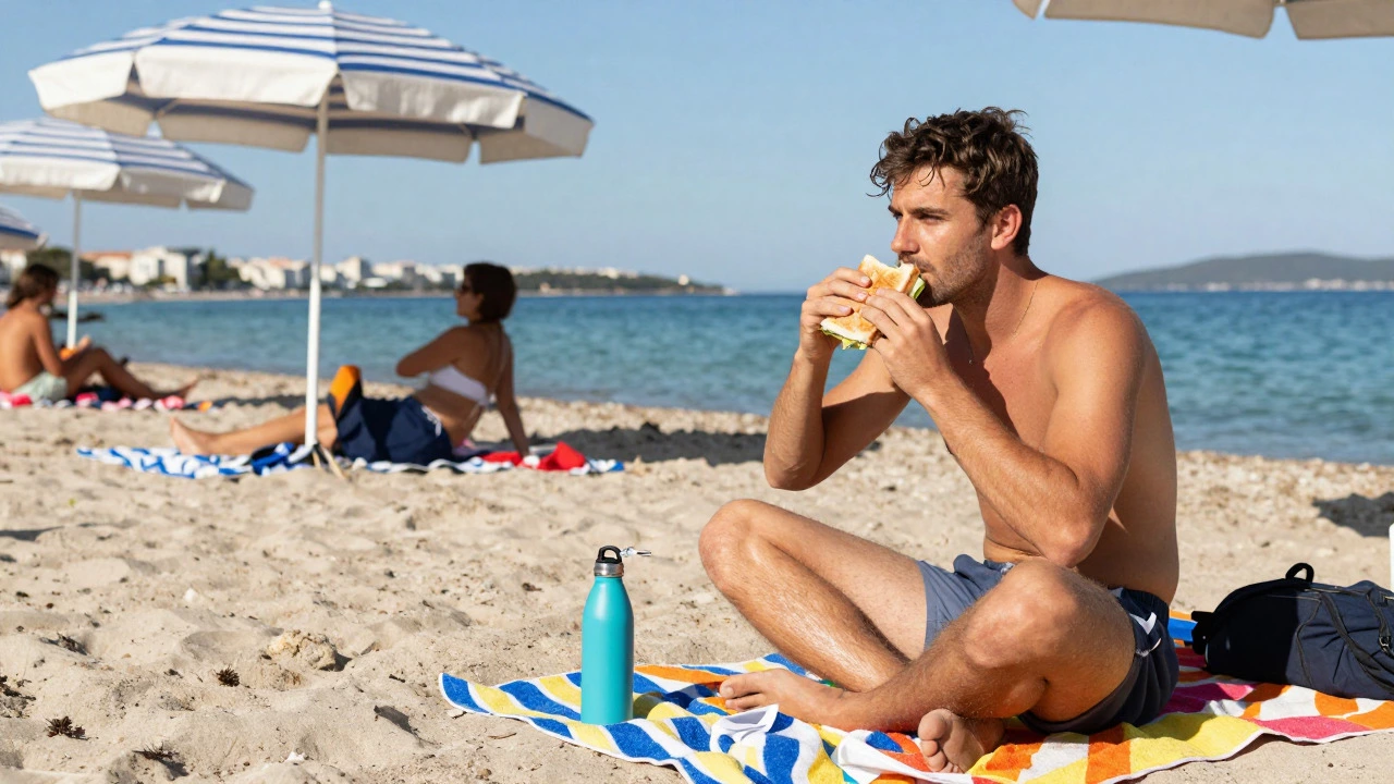Traveler relaxing on a towel at Bačvice Beach with a sandwich and water bottle.